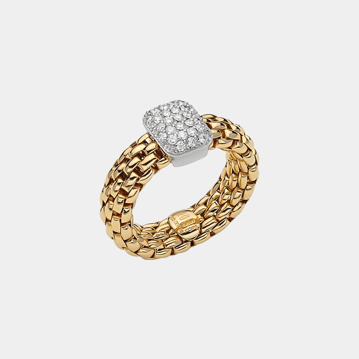 Yellow and white gold diamond stretch ring on grey background