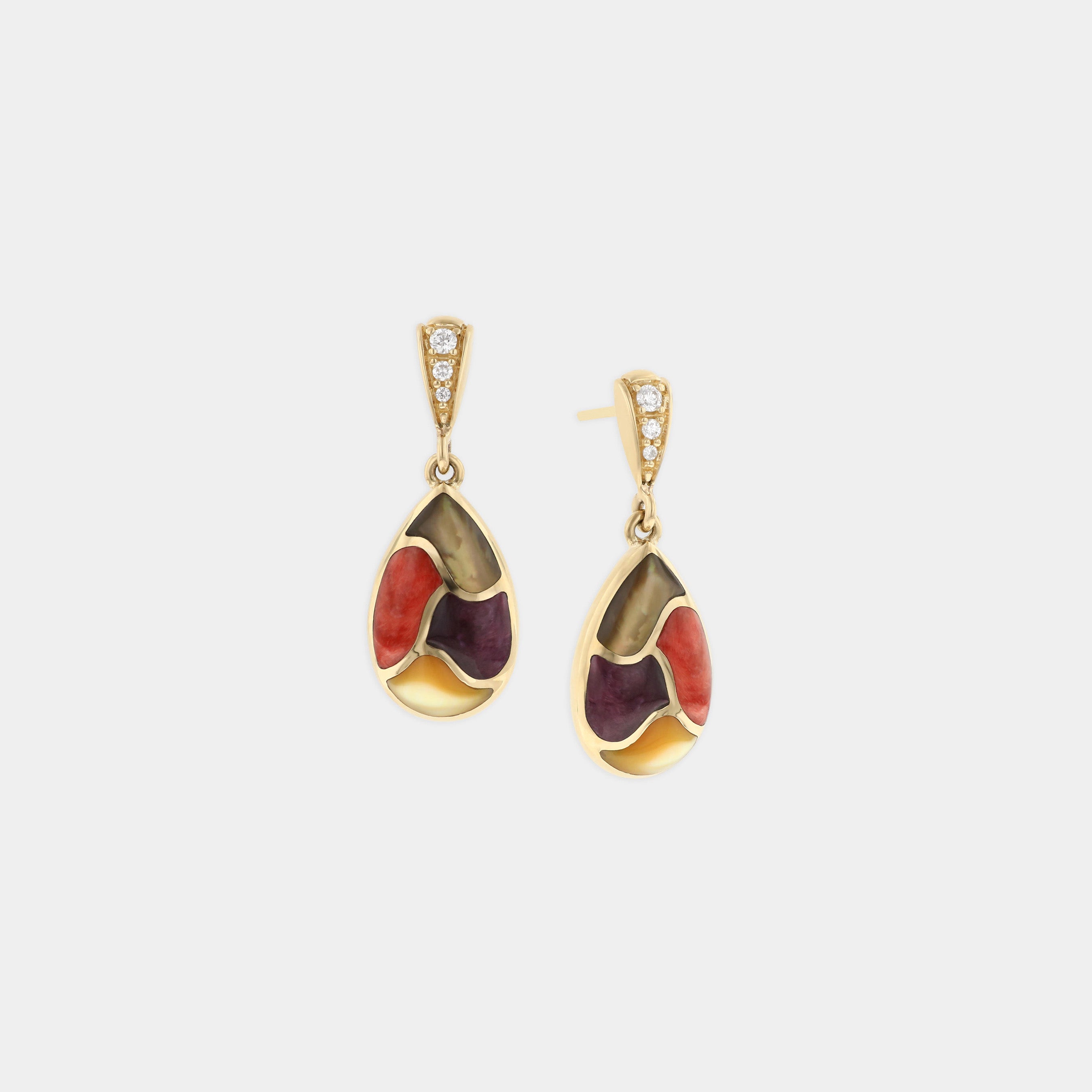 Mother of pearl and spiny oyster drop earrings on grey background