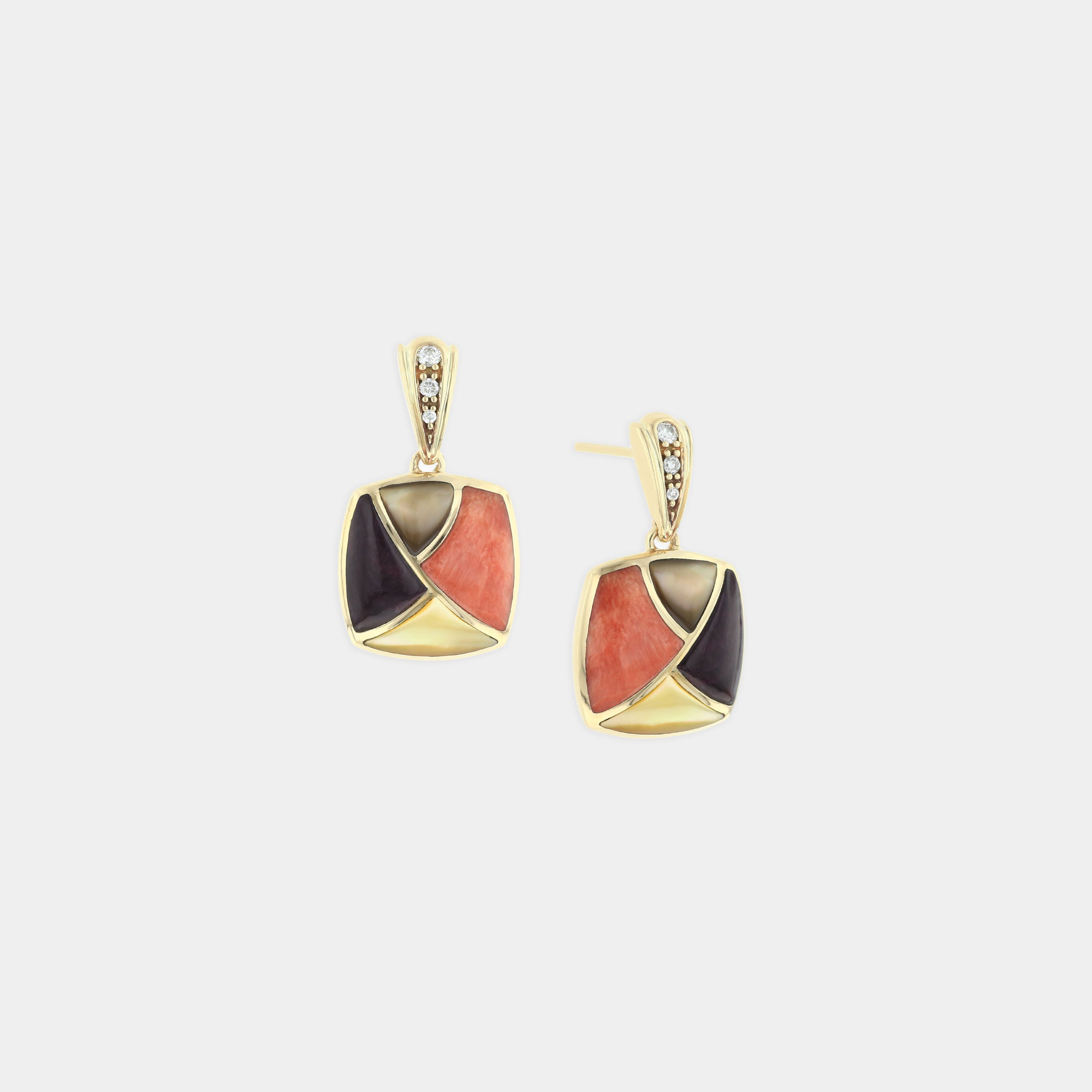 Mother of pearl earrings with diamond accents on grey background
