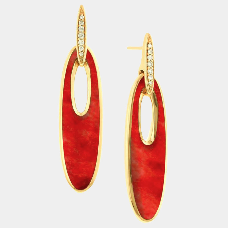 Red spiny oyster and other of pearl earrings with diamond on grey background