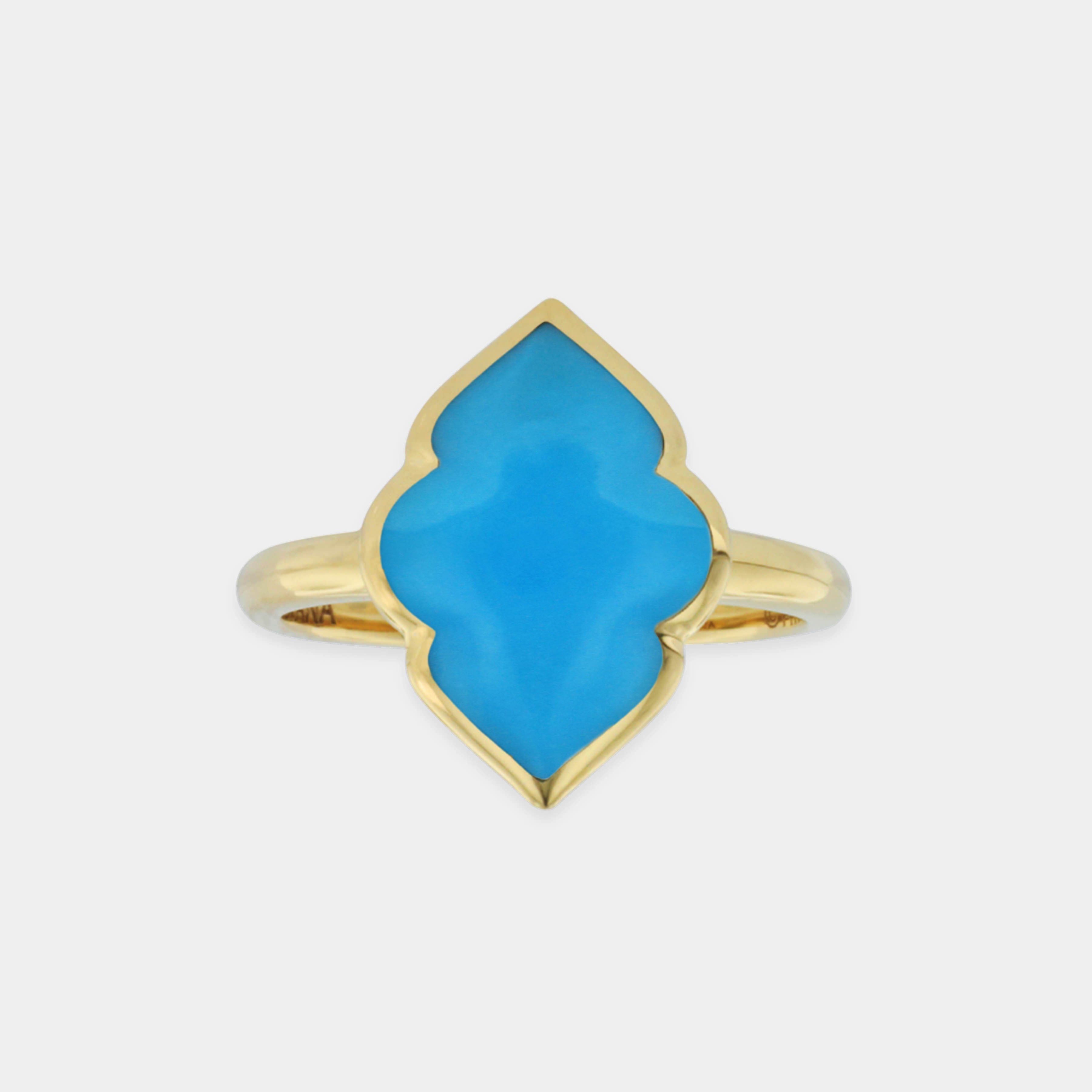 Yellow gold turquoise fashion ring on grey background