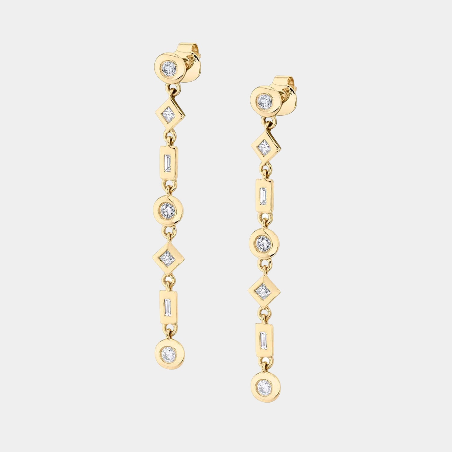 Yellow gold drop earrings with mixed shape bezel set diamonds on grey background