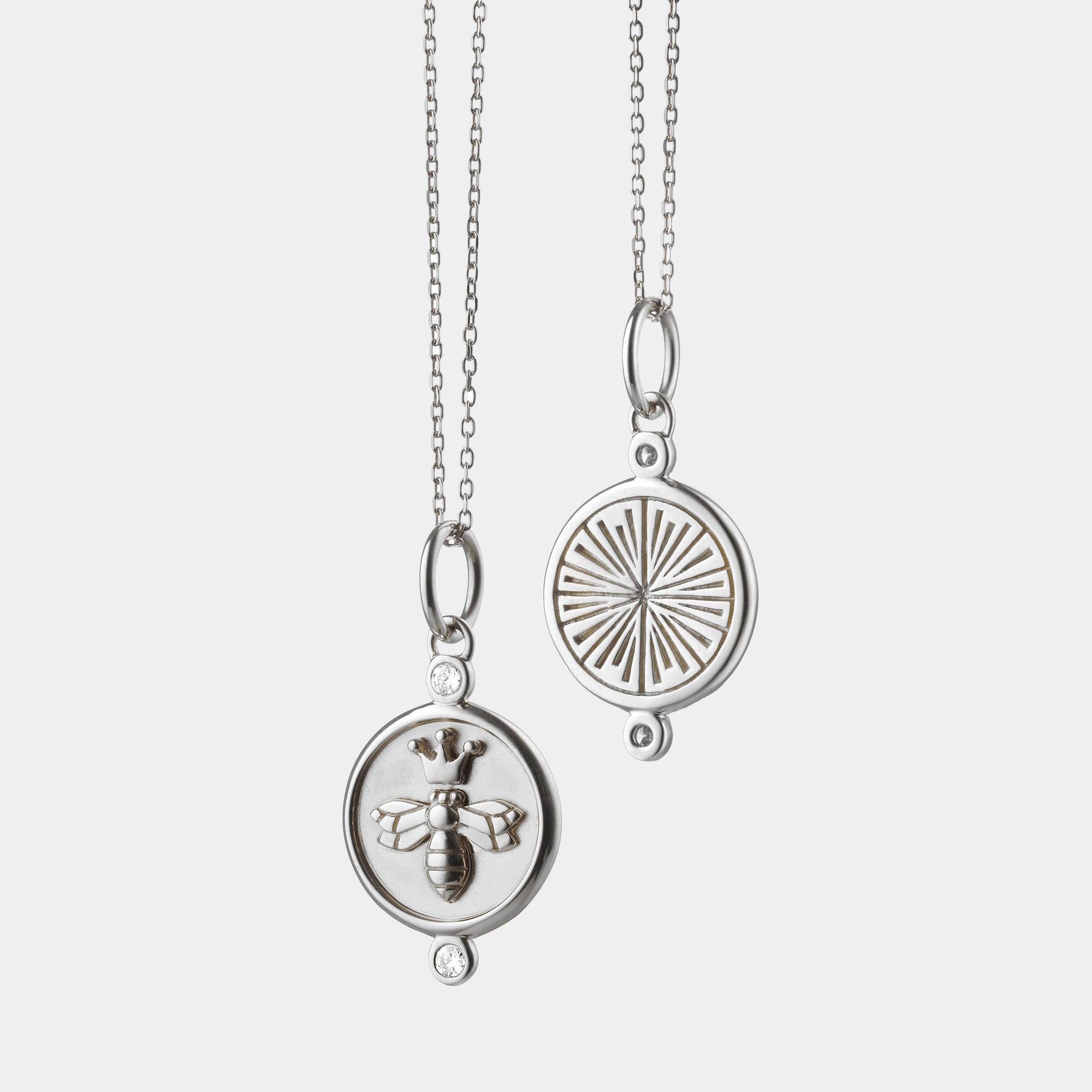 Sterling silver pendant necklace with bee and two white sapphires