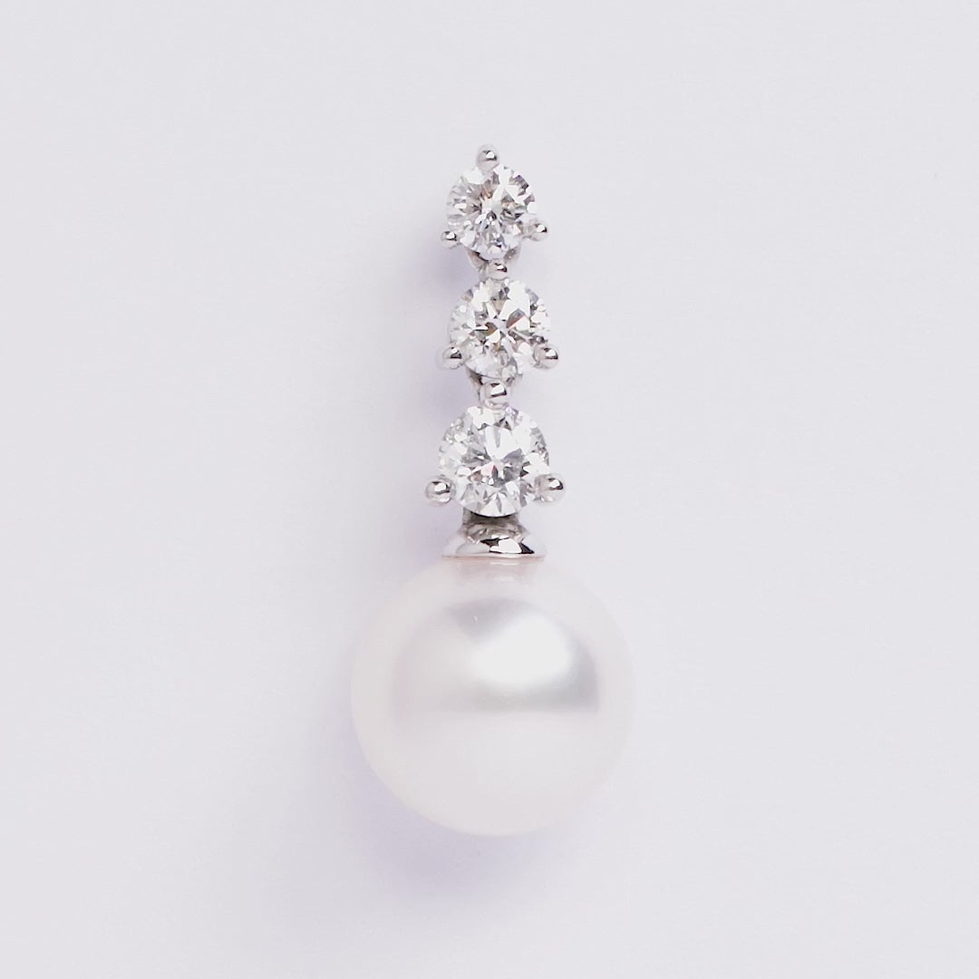 White gold pearl and diamond drop earrings on grey background, 360 spin