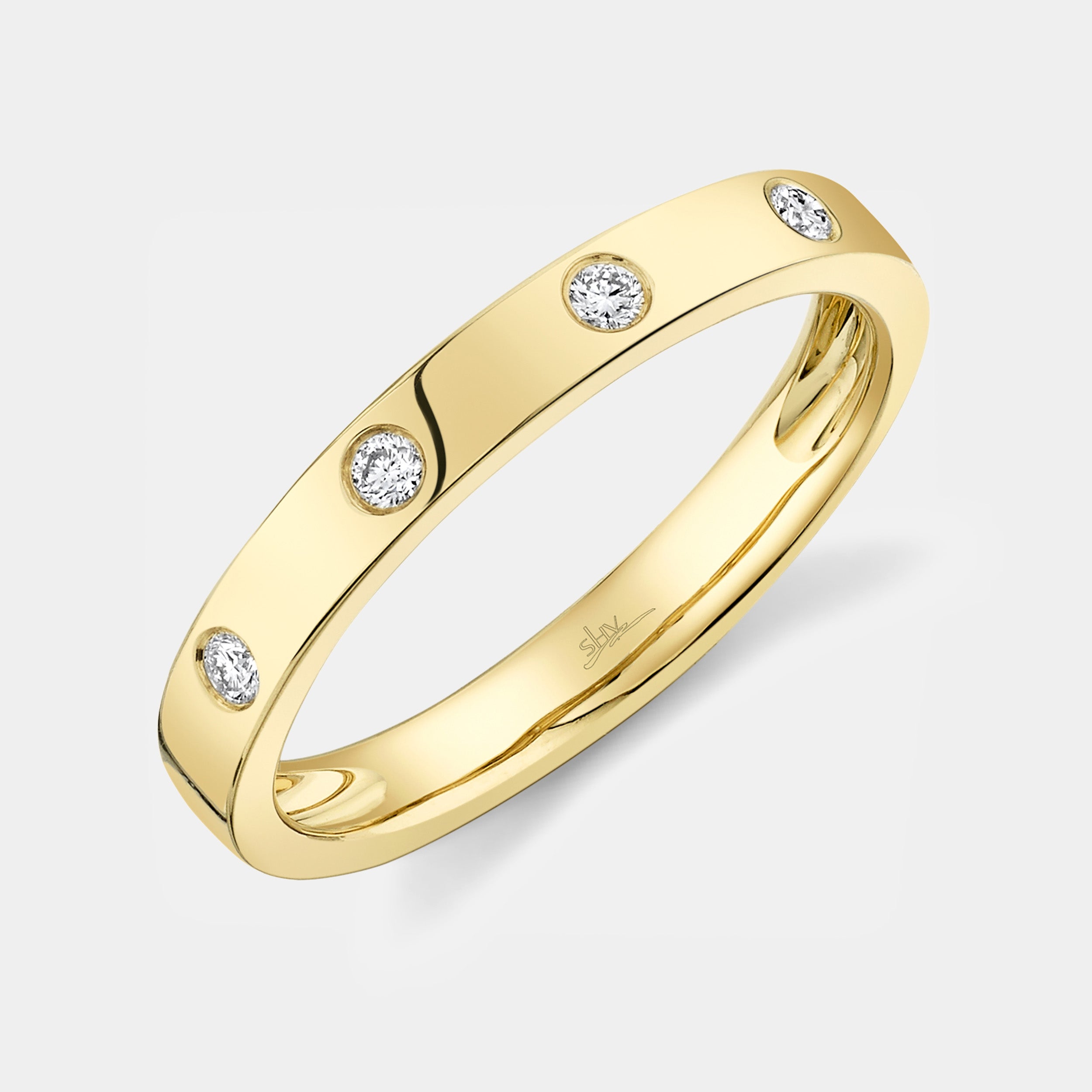 Yellow gold bezel set fashion ring, side angle view