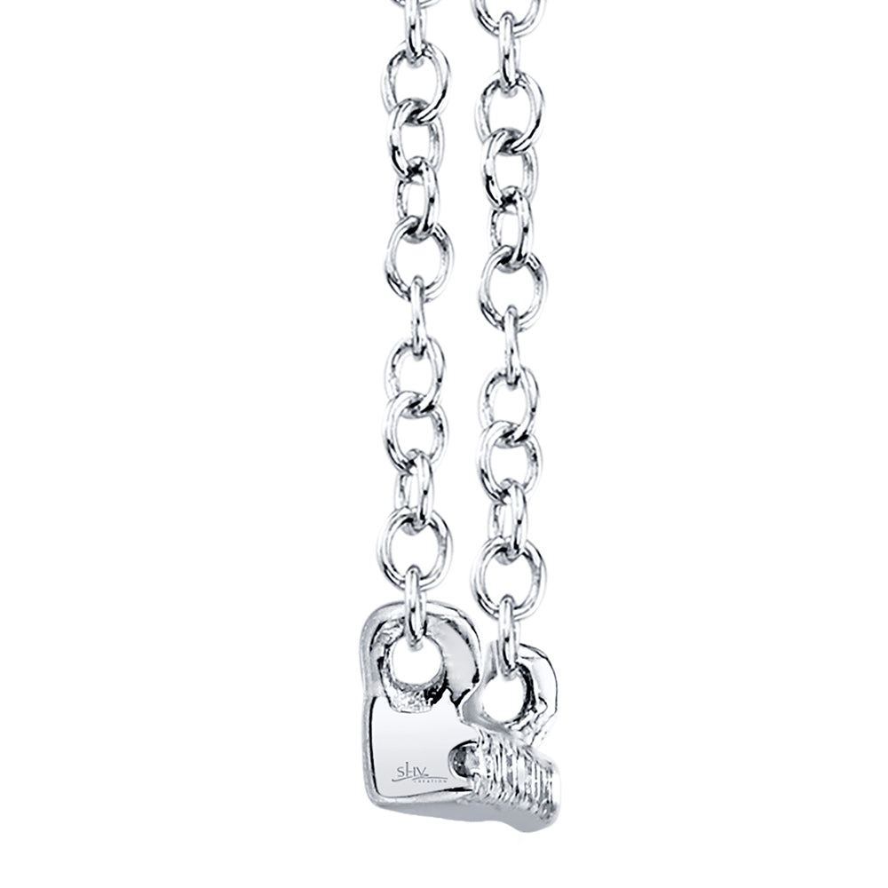 Side view of diamond bar necklace on a white background