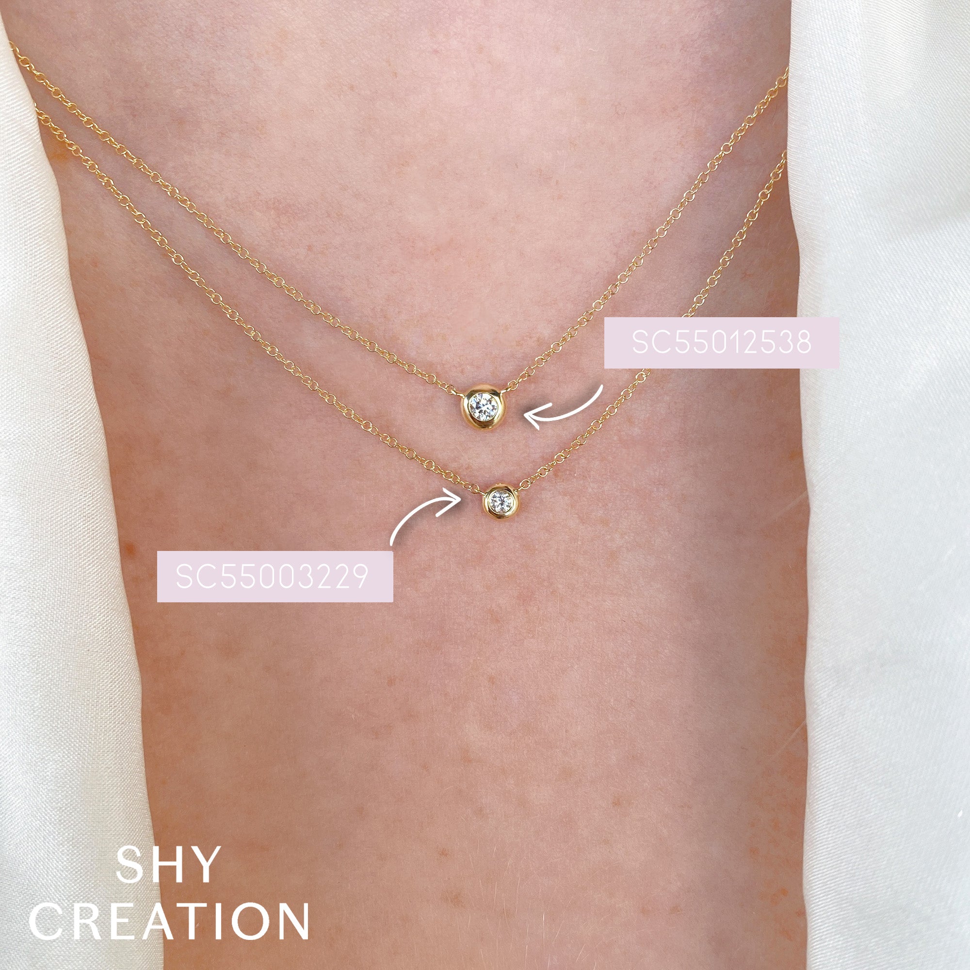 Gold bezel necklaceswith small round diamonds worn on a person's neck, with 'SHY CREATION' branding.