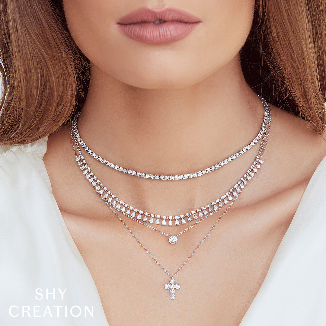 Women wearing white gold diamond halo pendant