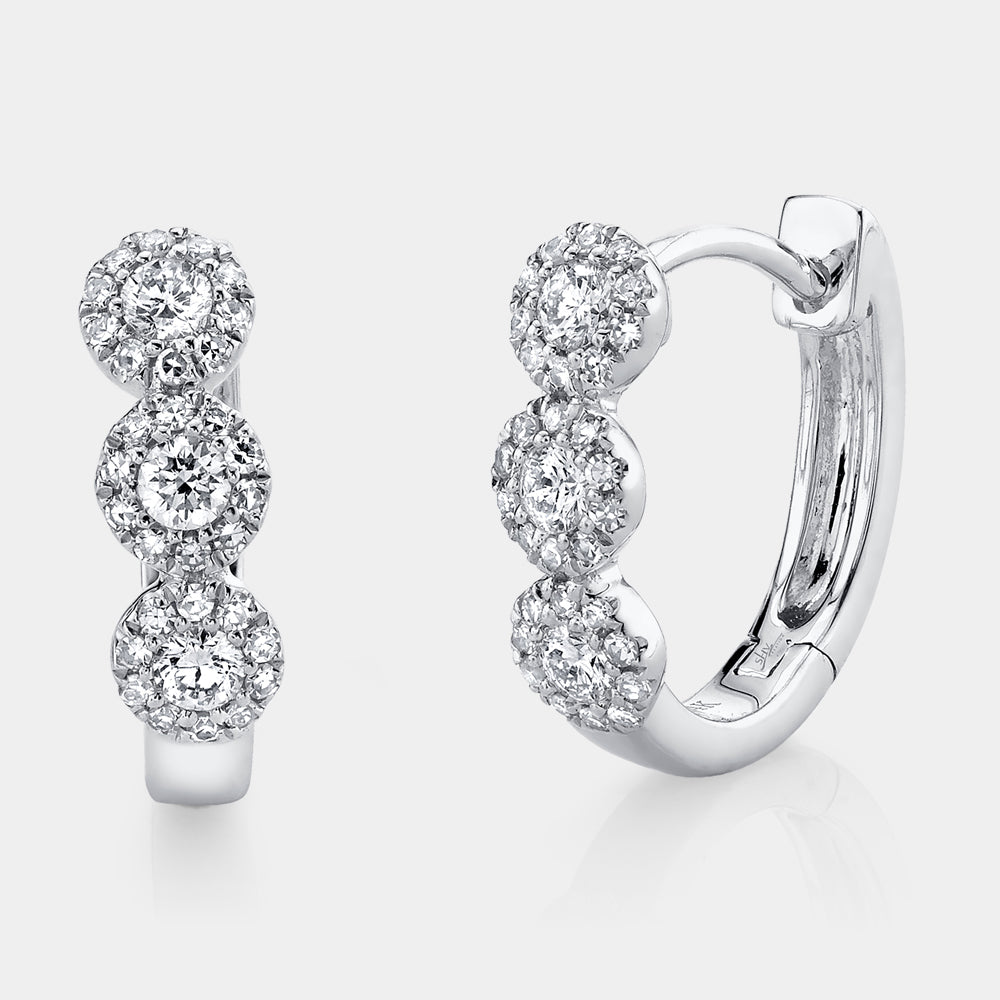 White gold diamond huggie earrings, front angle view