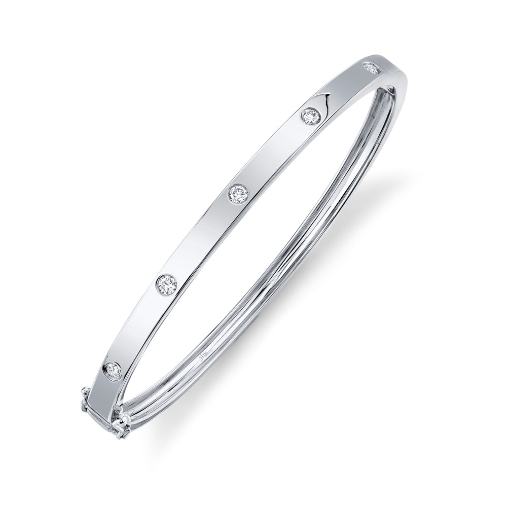 White gold bezel set diamond bangle bracelet, side angle view
