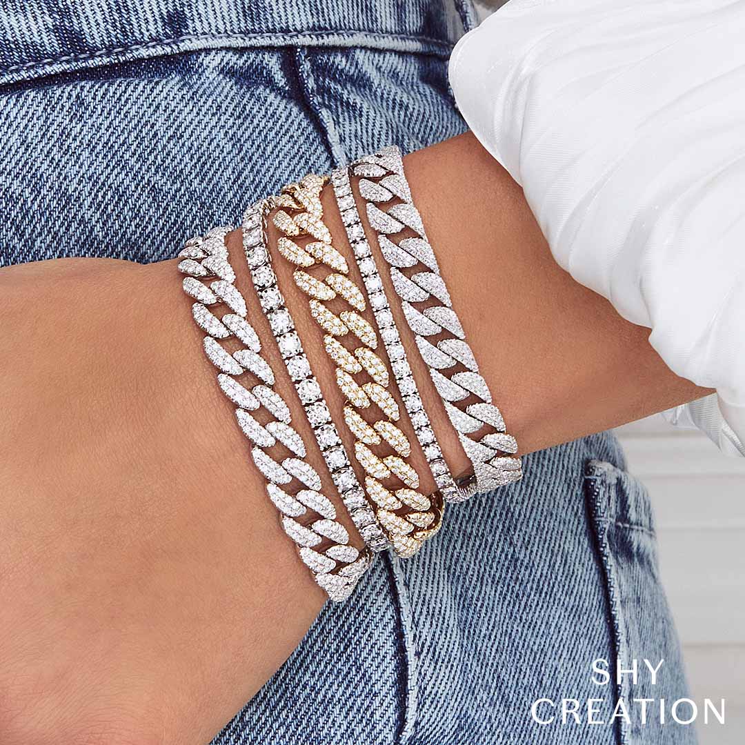 Woman wearing white gold diamond tennis bracelet, close-up wrist