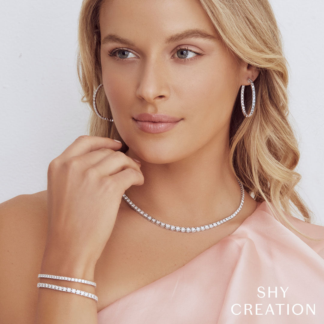 Woman wearing white gold diamond tennis bracelet
