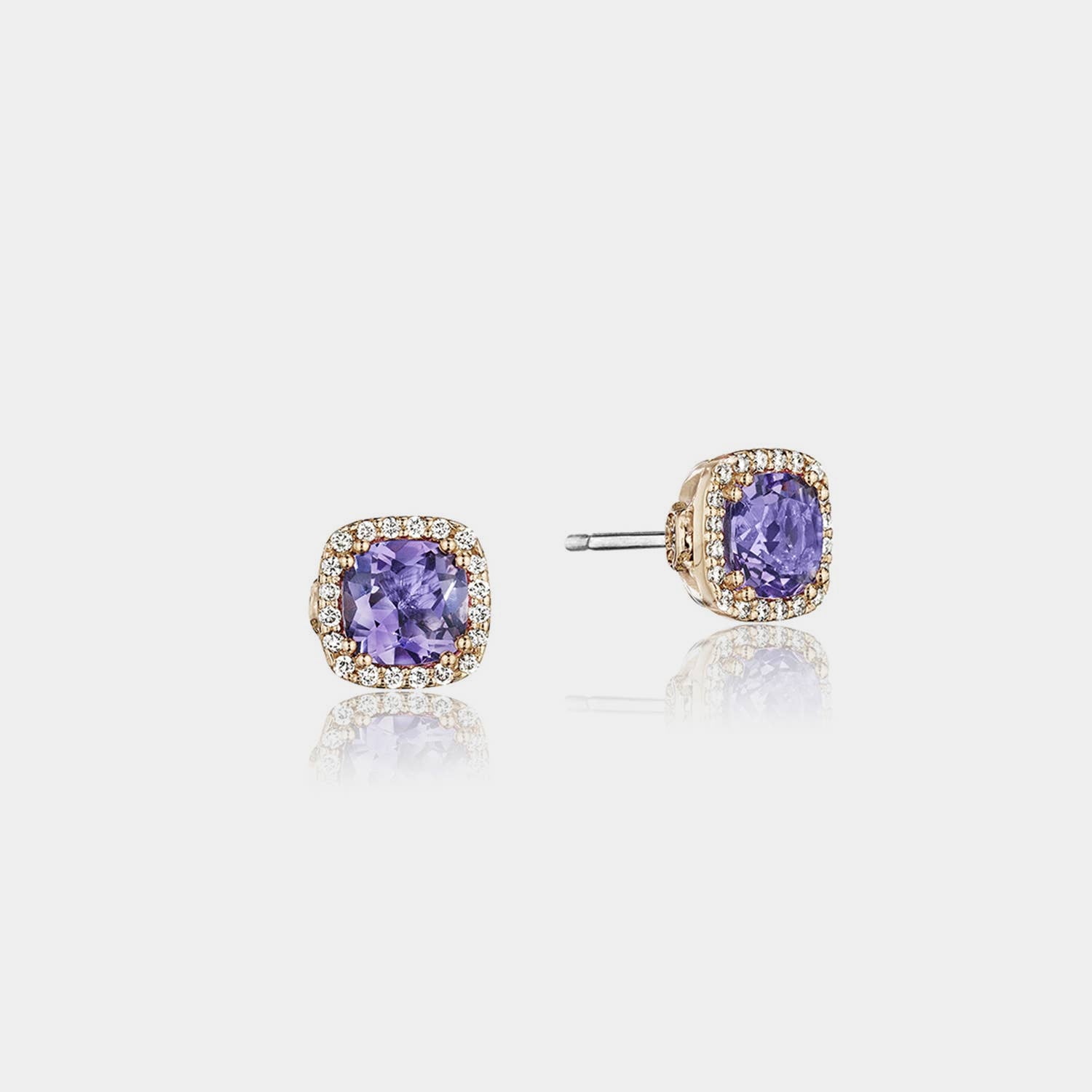 Sterling Silver and Rose Gold Amethyst and Diamond Stud Earrings on grey background.