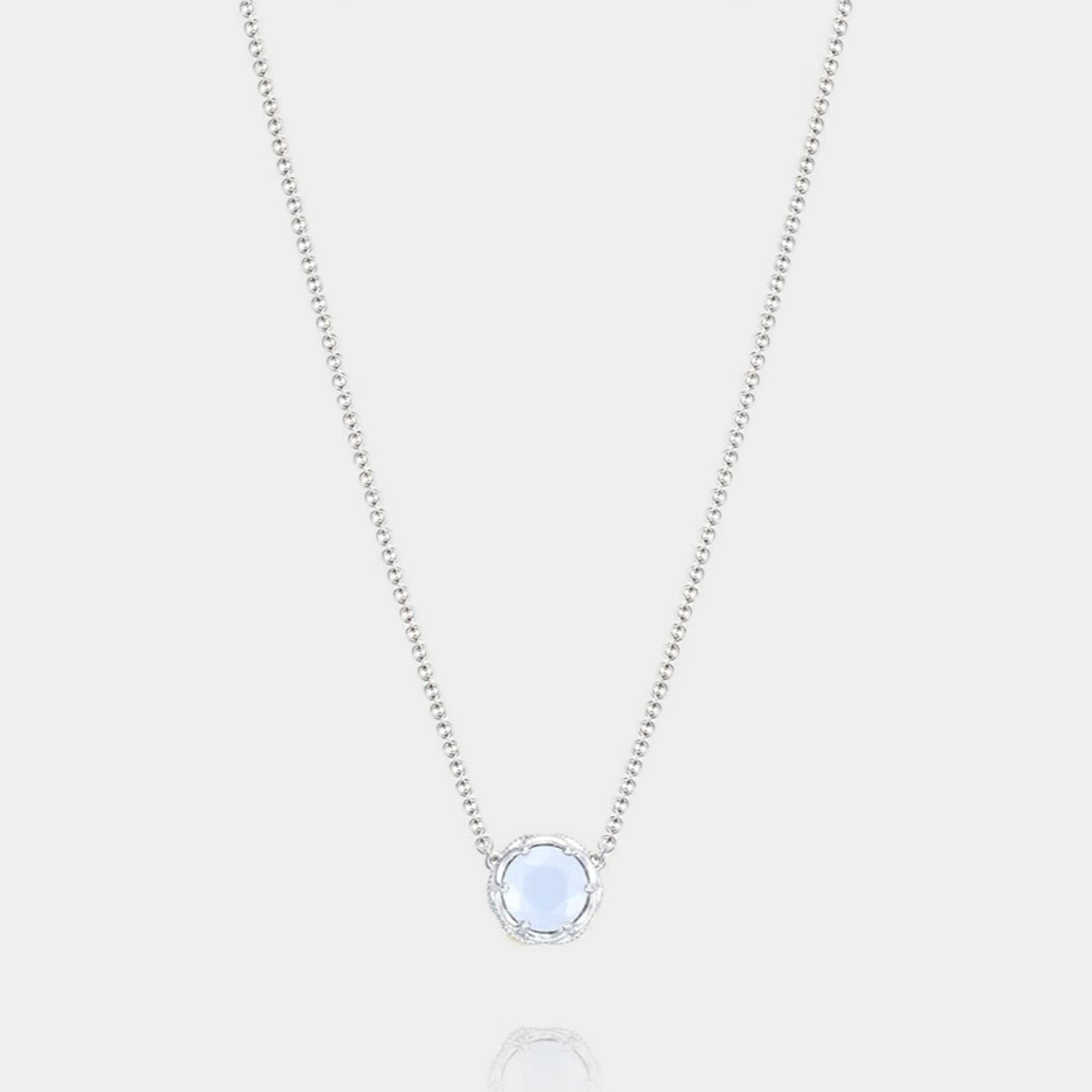 Sterling Silver and Yellow Gold Chalcedony Pendant Necklace on grey background.