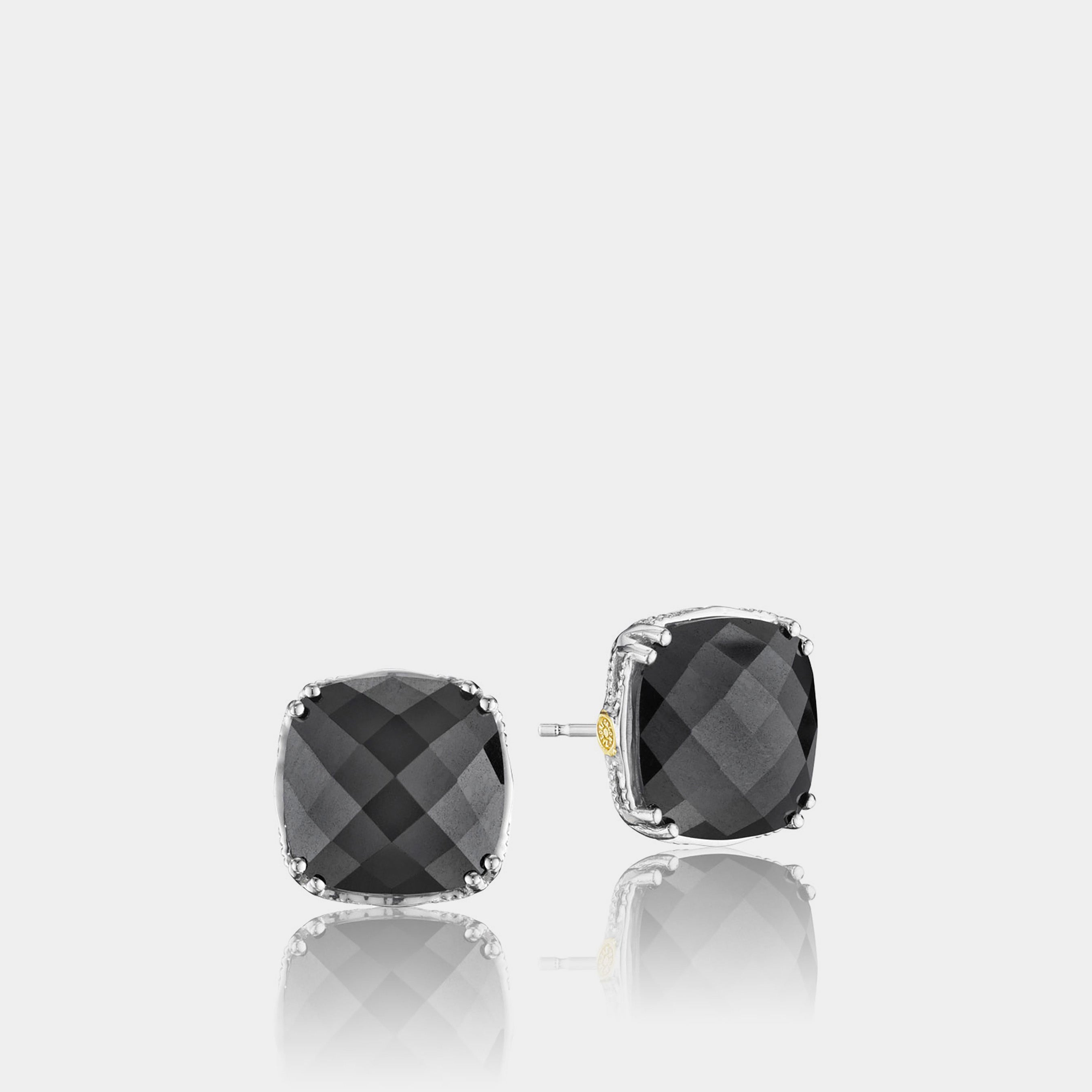 Sterling Silver and Yellow Gold Hematite Earrings on grey background.