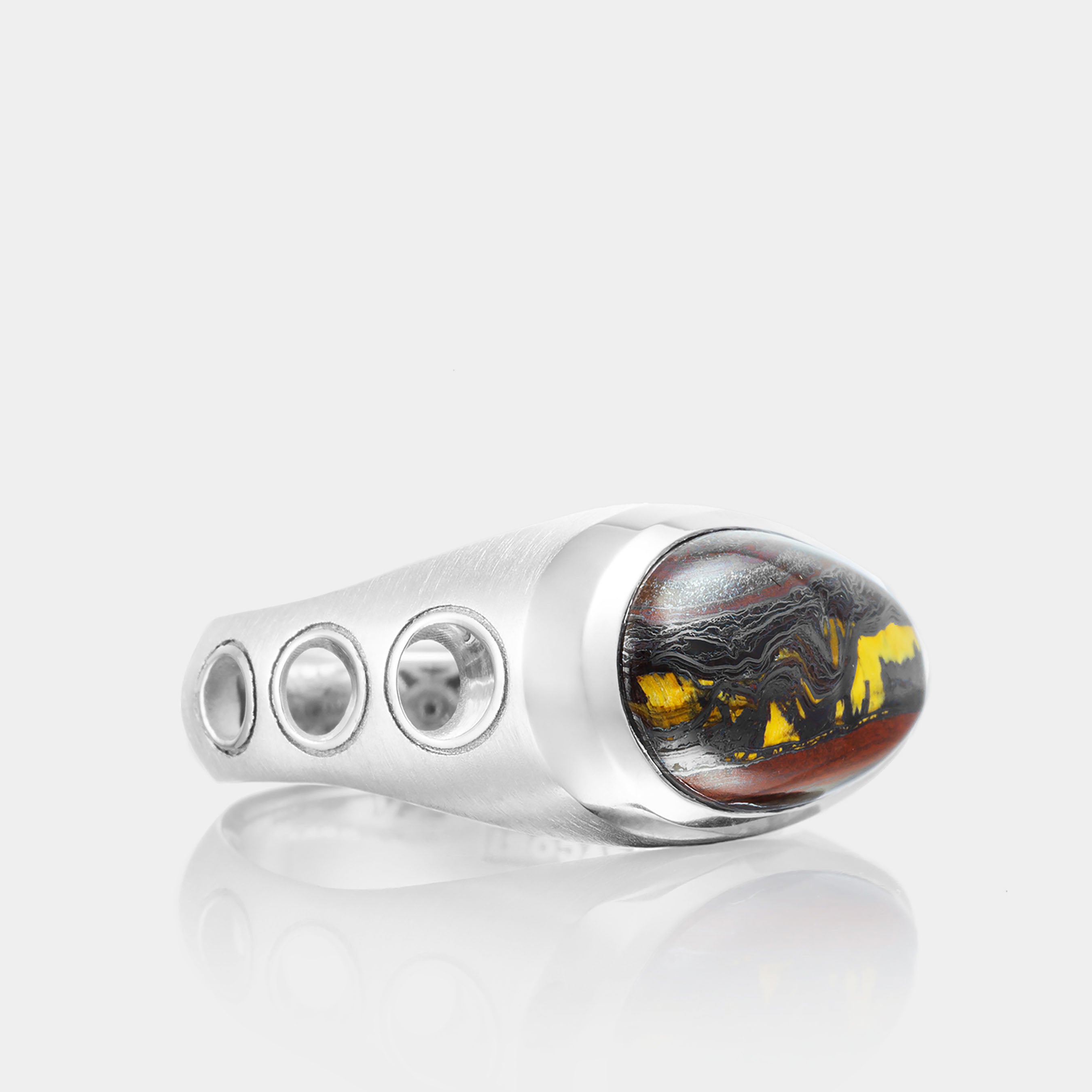 Men’s Sterling Silver Oval Tiger Iron Ring on grey background, side view