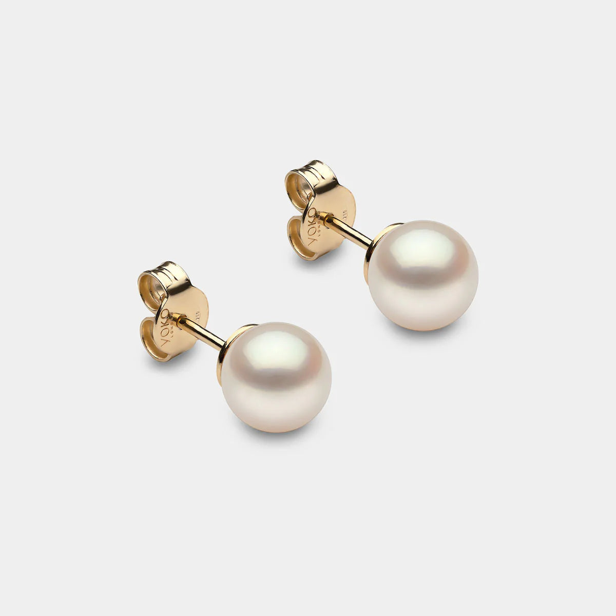 Yellow gold pearl stud earrings, front angle view