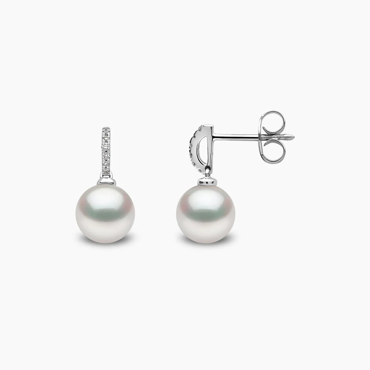 White gold pearl drop earrings with diamond accents, front and side view