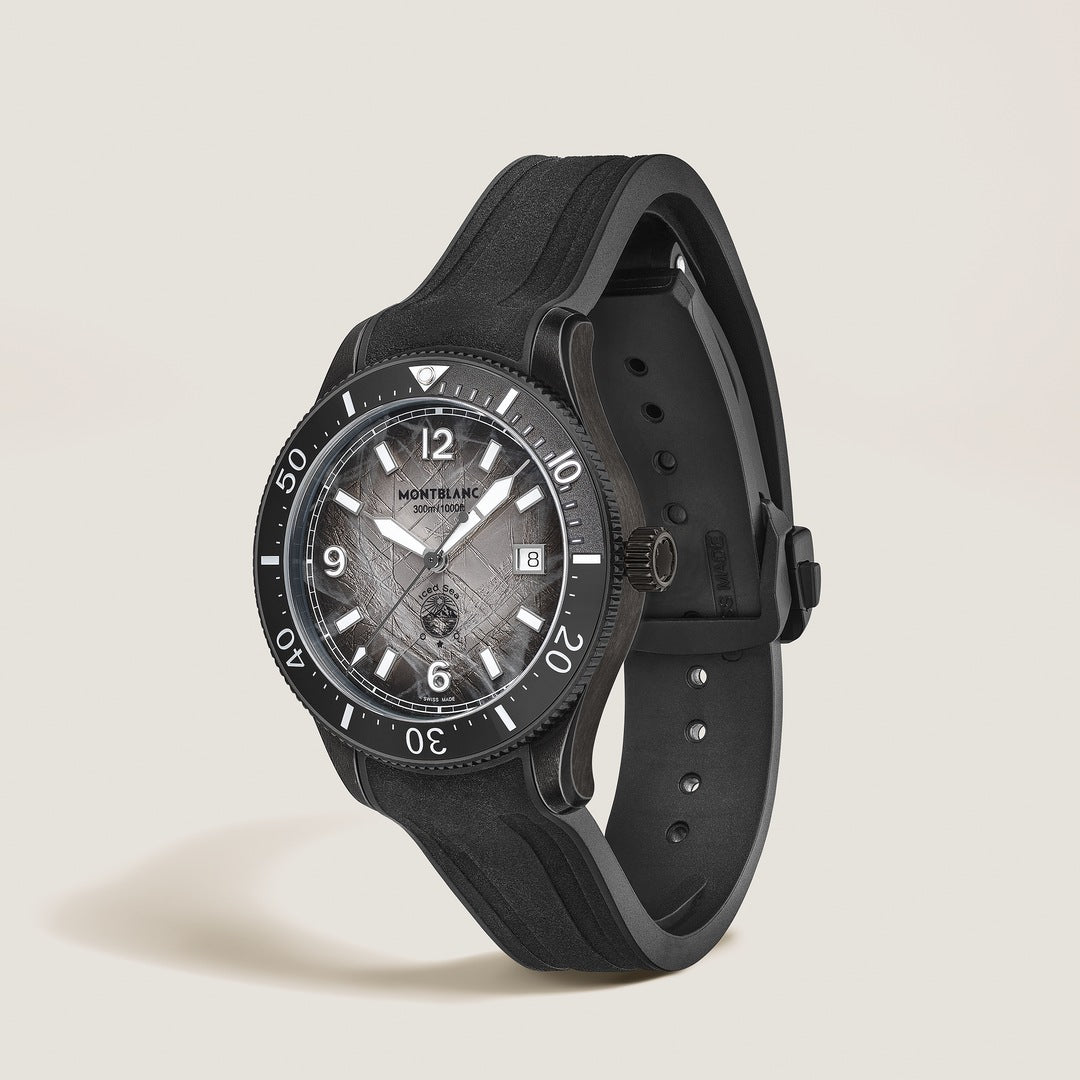Black Montblanc watch on a light beige background