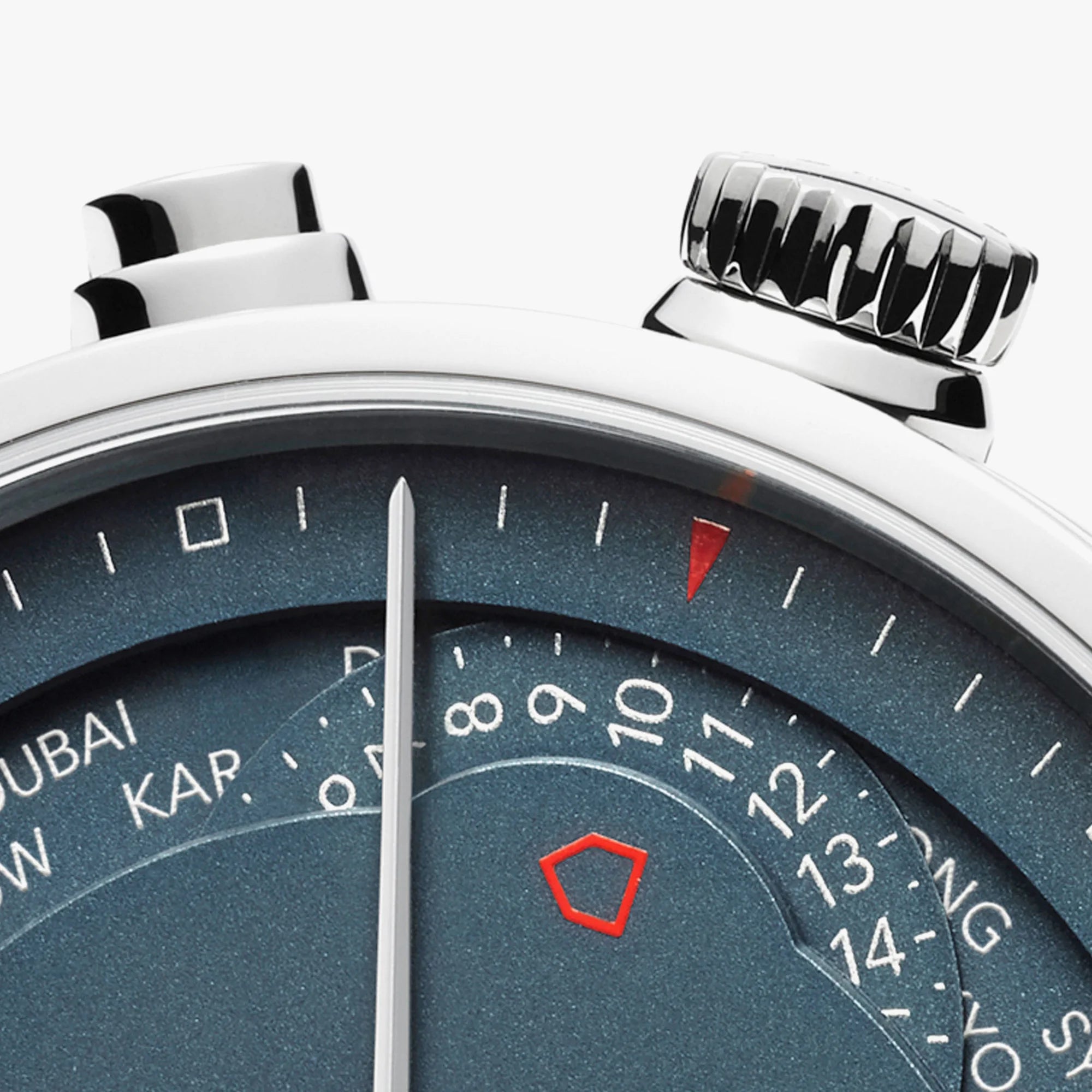 Close-up of a watch face with a blue dial and silver accents.