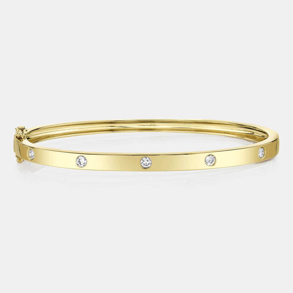 Yellow gold bezel set diamond bangle bracelet, front angle view