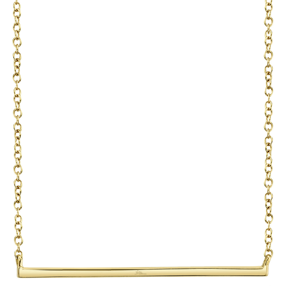Gold necklace with a horizontal bar pendant on a white background