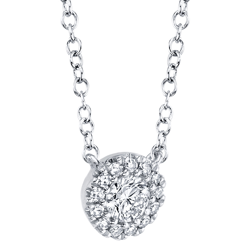 White gold diamond necklace on a light gray background, side angle view