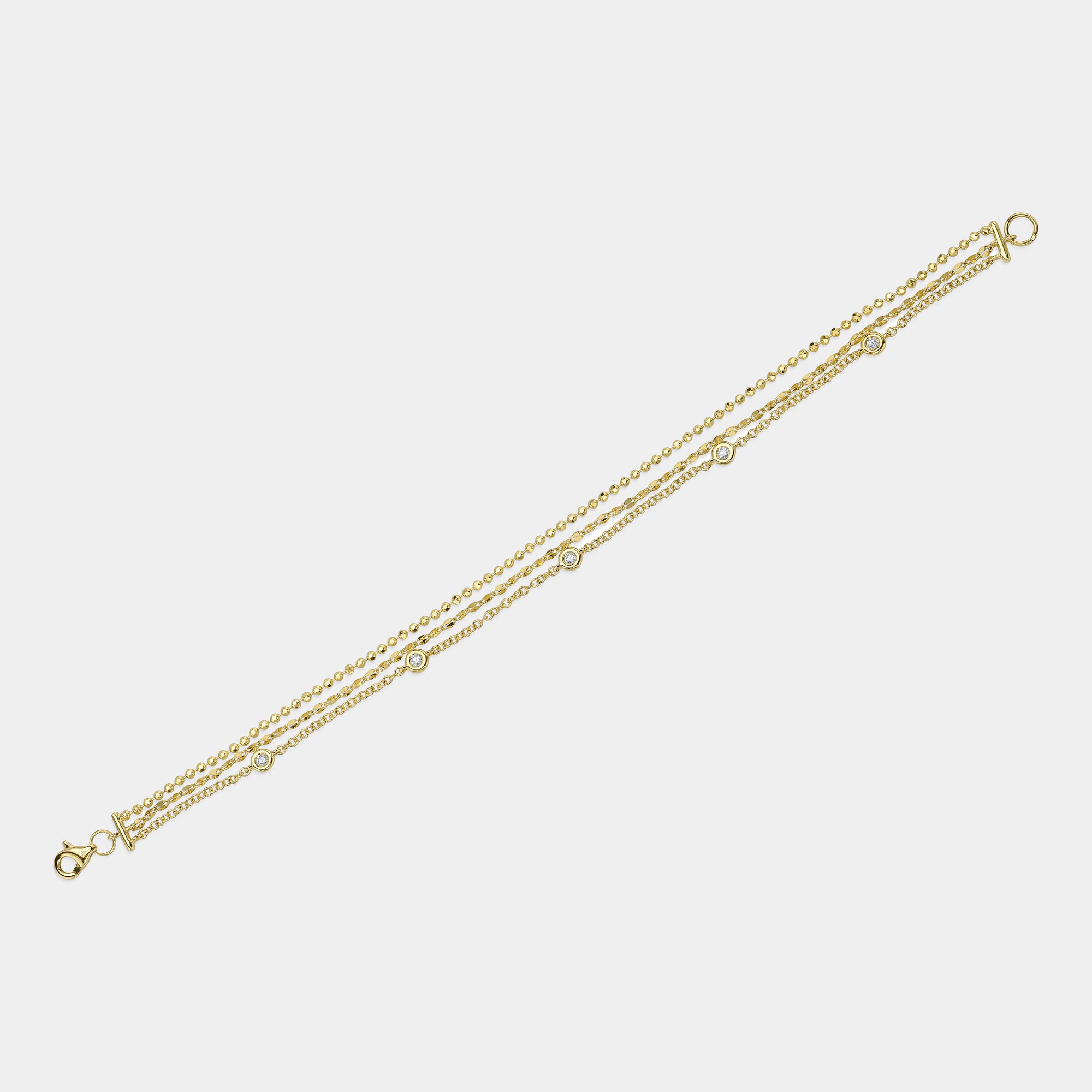 Yellow gold diamonds by the yard bracelet, flat lay